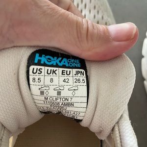 Hoka One Clifton oatmeal colored shoes
